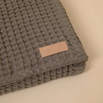 Load image into Gallery viewer, Organic Weightless Waffle Throw Blanket | Coal
