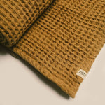 Load image into Gallery viewer, Organic Weightless Waffle Throw Blanket | Dijon
