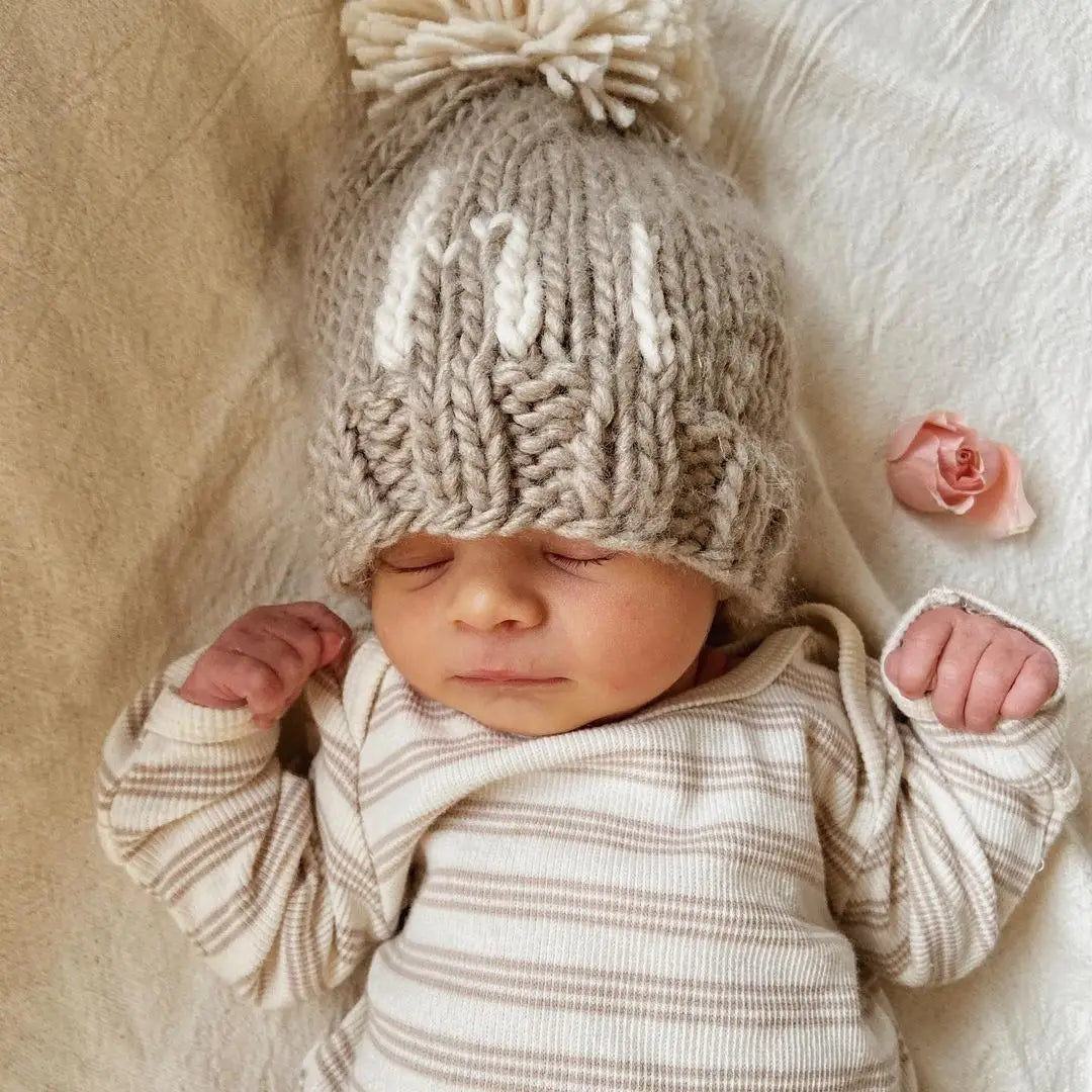 hi. Pebble Pom Pom Beanie Hat